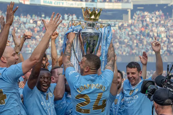 Kyle Walker of Manchester City lifts the Premier League Trophy during the Premier League match Manchester City vs West Ham United at Etihad Stadium, Manchester, United Kingdom, 19th May 2024 