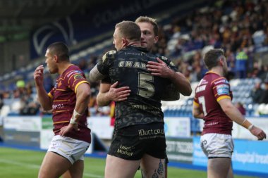 Leoparlar 'dan Josh Charnley, 24 Mayıs 2024' te İngiltere 'nin Huddersfield Stadyumu' nda oynanan 12. Betfred Süper Lig karşılaşmasında Huddersfield Giants - Leigh Leopards karşılaşmasını kutluyor. 