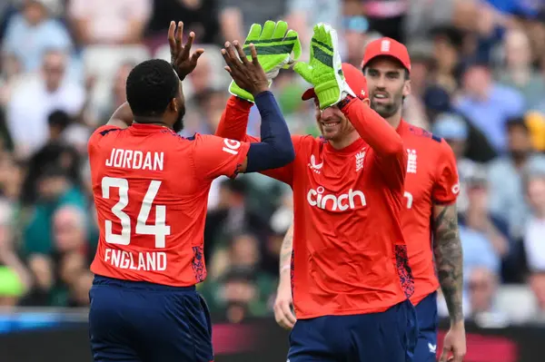 stock image Chris Jordan of England and Jos Buttler of England celebrates the dismissal of Mohammad Amir of Pakistan during the Vitality T20 International Series match England vs Pakistan at Edgbaston, Birmingham, United Kingdom, 25th May 2024 