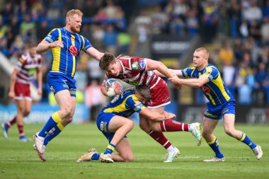 Wigan Warriors 'dan Ethan Havard, 1 Haziran 2024' te İngiltere 'nin Warrington şehrinde oynanan 13. Betfred Süper Lig karşılaşmasında Warrington Wolves' a karşı Wigan Warriors maçında Warrington Wolves 'tan Tom Whitehead tarafından yenildi.