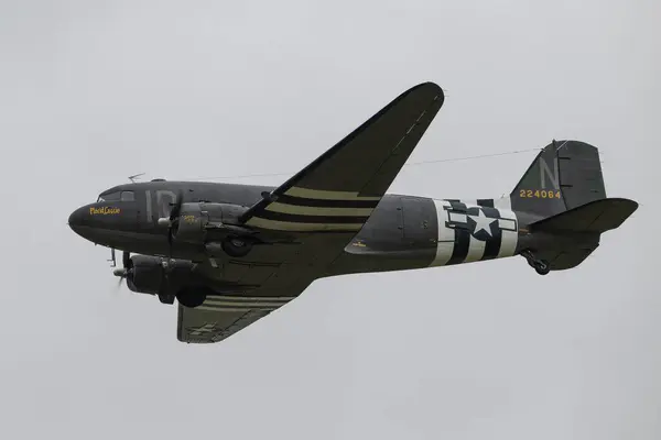 stock image C-47 Skytrain Placid Lassie passes over, during the Duxford Summer Air Show: D-Day 80 at IWM Duxford, Duxford, United Kingdom, 1st June 2024