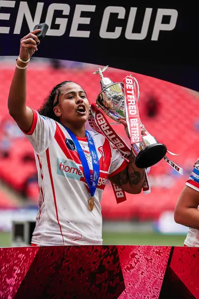stock image St Helens celebrate lifting the trophy following the Betfred Women's Challenge Cup Final match Leeds Rhinos vs St Helens at Wembley Stadium, London, United Kingdom, 8th June 2024 