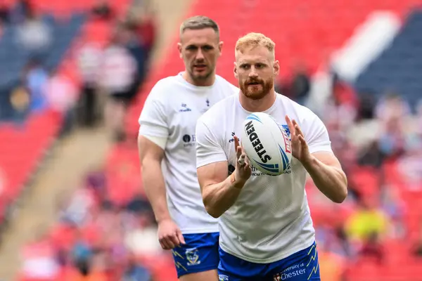 stock image Joe Bullock of Warrington Wolves during the pre-game warm up ahead of the Betfred Challenge Cup Final match Warrington Wolves vs Wigan Warriors at Wembley Stadium, London, United Kingdom, 8th June 2024 