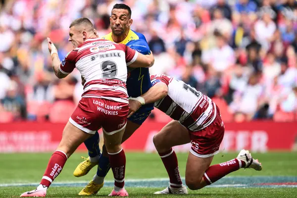 stock image Paul Vaughan of Warrington Wolves is tackled by Brad ONeill of Wigan Warriors during the Betfred Challenge Cup Final match Warrington Wolves vs Wigan Warriors at Wembley Stadium, London, United Kingdom, 8th June 2024 