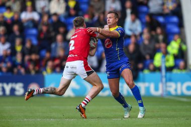 Salford Red Devils 'ten Ethan Ryan, 14 Haziran 2024' te Warrington Wolves 'un Halliwell Jones Stadyumu' nda oynanan 14. Warrington Süper Lig karşılaşmasında Warrington Wolves ve Salford Red Devils arasında oynanan karşılaşmada Warrington Wolves 'tan Josh Drinkwater tarafından yenildi. 