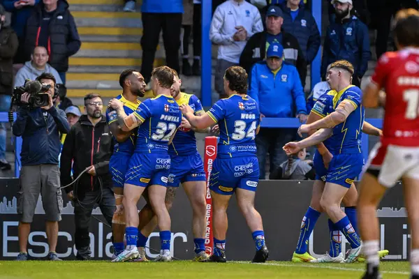 stock image Rodrick Tai of Warrington Wolves celebrates his try to make it 4-19 during the Betfred Super League Round 14 match Warrington Wolves vs Salford Red Devils at Halliwell Jones Stadium, Warrington, United Kingdom, 14th June 2024 