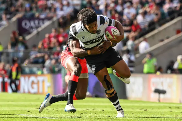 stock image Selestino Ravutaumada of Fiji tackles Leicester Faingaanuku of Barbarians during the Killik Cup match Barbarians vs Fiji at Twickenham Stadium, Twickenham, United Kingdom, 22nd June 2024 