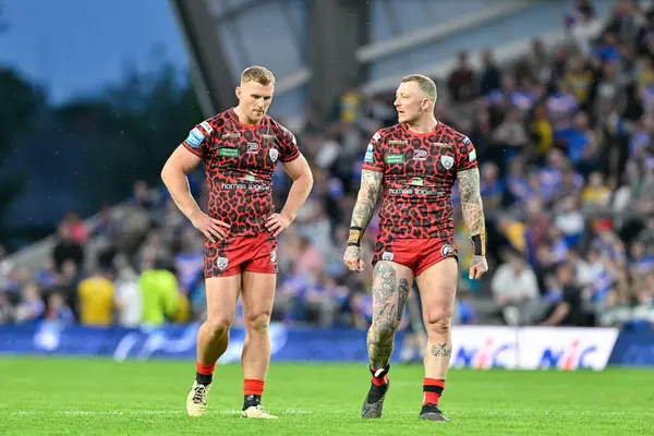 stock image Jack Hughes of Leigh Leopards and Josh Charnley of Leigh Leopards dejected at full time during the Betfred Super League Round 15 match Leeds Rhinos vs Leigh Leopards at Headingley Stadium, Leeds, United Kingdom, 21st June 2024 