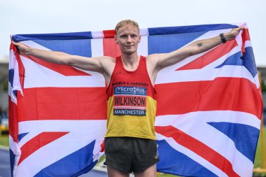 Callum Wilkinson celebrates winning the 10000m with a new national record during the Microplus UK Athletics Championships Day 2 at Manchester Regional Arena, Manchester, United Kingdom, 30th June 2024  clipart