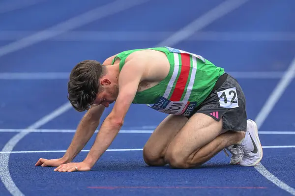 stock image Wharton is exhausted after the third Heat during the Microplus UK Athletics Championships Day 1 at Manchester Regional Arena, Manchester, United Kingdom, 29th June 2024 