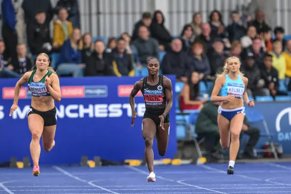 stock image Dina Asher-Smith in the third heat of the women's 200m during the Microplus UK Athletics Championships Day 2 at Manchester Regional Arena, Manchester, United Kingdom, 30th June 2024 