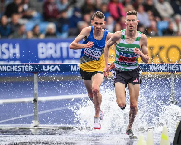 stock image Phil Norman leads the men's 3000m steeplechase during the Microplus UK Athletics Championships Day 2 at Manchester Regional Arena, Manchester, United Kingdom, 30th June 2024   