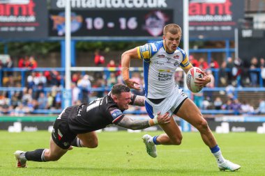 Londra Broncos takımından Robbie Storey, Leeds Rhinos 'tan Ash Handley' i 6 Temmuz 2024 'te Headingley Stadyumu' nda oynanan 16. Betfred Süper Lig karşılaşmasında yendi. 