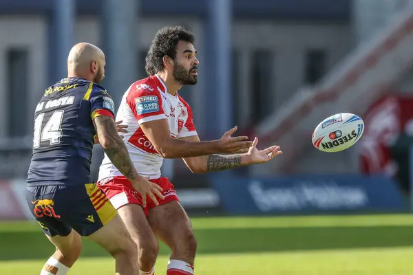 stock image Tyrone May of Hull KR passes the ball under pressure from Alrix Da Costa of Catalan Dragons during the Betfred Super League Round 16 match Hull KR vs Catalans Dragons at Sewell Group Craven Park, Kingston upon Hull, United Kingdom, 6th July 2024 