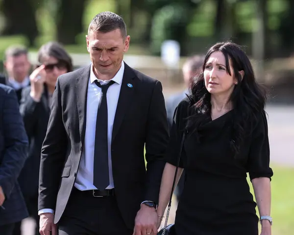 stock image Kevin Sinfield his wife Jayne Sinfield leave Pontefract Crematorium after Rob CBE Burrow Funeral at Pontefract Crematorium, Pontefract, United Kingdom, 7th July 2024 