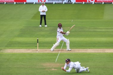 Kavem Hodge of West Indies hits the ball straight into the hands of Ollie Pope of England during the 1st Rothesay Test Match day 1 England v West Indies at Lords, London, United Kingdom, 10th July 2024  clipart