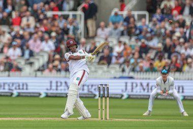 Kavem Hodge of West Indies hits the ball for four runs during the 1st Rothesay Test Match day 1 England v West Indies at Lords, London, United Kingdom, 10th July 2024  clipart