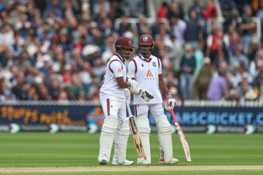 Alick Athanaze of West Indies and Kavem Hodge of West Indies bump fists during the 1st Rothesay Test Match day 1 England v West Indies at Lords, London, United Kingdom, 10th July 2024  clipart