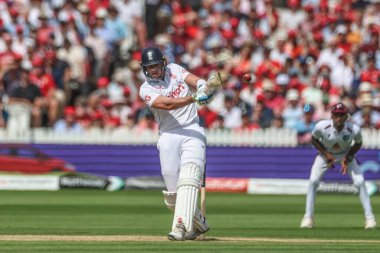 Jamie Smith of England hits the ball into the hands of Jayden Seales of West Indies during the Rothesay Test Match Day Two England v West Indies at Lords, London, United Kingdom, 11th July 2024 clipart