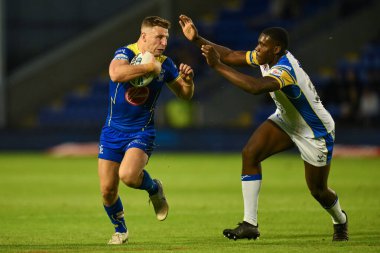 Warrington Wolves 'tan George Williams, 17. Betfred Süper Lig karşılaşmasında Warrington Wolves, Leeds Gergedan' a karşı Halliwell Jones Stadyumu, Warrington, İngiltere 'de 11 Temmuz 2024' te oynanan karşılaşmada ilk hamlesini yaptı. 