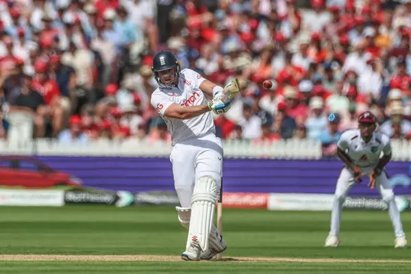 stock image Jamie Smith of England hits the ball into the hands of Jayden Seales of West Indies during the Rothesay Test Match Day Two England v West Indies at Lords, London, United Kingdom, 11th July 2024