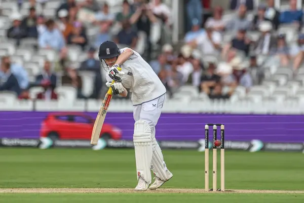 stock image Harry Brook of England hits the ball for two runs during the 1st Rothesay Test Match day 1 England v West Indies at Lords, London, United Kingdom, 10th July 2024 