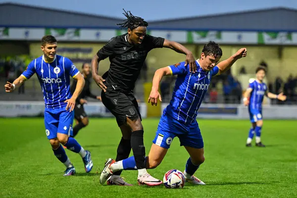 stock image Niall Ennis of Stoke City and Harrison Burke of Chester battle for the ball during the Pre-season friendly match Chester vs Stoke City at Deva Stadium, Chester, United Kingdom, 11th July 2024 