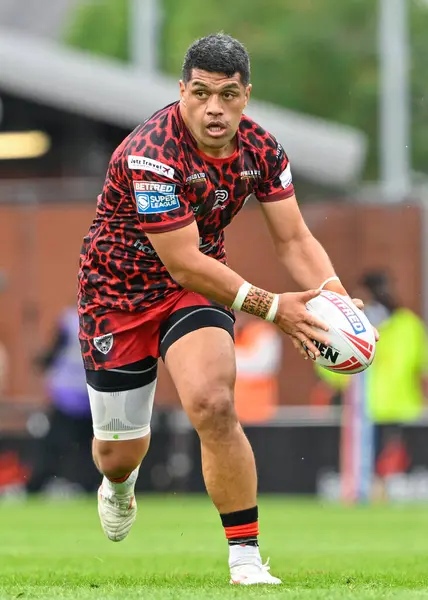 stock image John Asiata of Leigh Leopards looks for a pass during the Betfred Super League Round 17 match Leigh Leopards vs Huddersfield Giants at Leigh Sports Village, Leigh, United Kingdom, 13th July 2024 