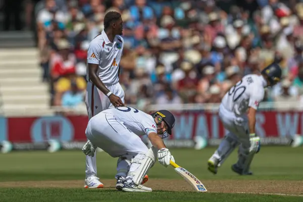 stock image Joe Root of England reaches for the crease as he makes two runs during the 2nd Rothesay Test Match match England vs West Indies at Trent Bridge, Nottingham, United Kingdom, 18th July 2024 