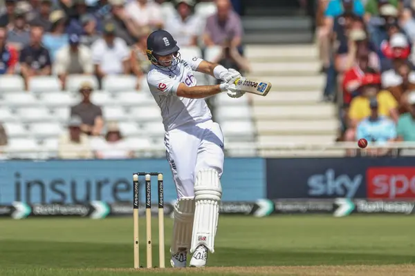 stock image Joe Root of England hits the ball for four runs during the 2nd Rothesay Test Match match England vs West Indies at Trent Bridge, Nottingham, United Kingdom, 18th July 2024 