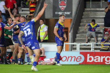 George Williams of Warrington Wolves celebrates Adam Holroyd of Warrington Wolves  try to make it 10-16 during the Betfred Super League Round 18 match St Helens vs Warrington Wolves at Totally Wicked Stadium, St Helens, United Kingdom, 19th July 2024 clipart