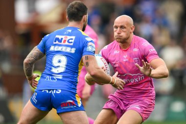 Dean Hadley of Hull KR is tackled by Andy Ackers of Leeds Rhinos during the Betfred Super League Round 18 match Leeds Rhinos vs Hull KR at Headingley Stadium, Leeds, United Kingdom, 20th July 2024 clipart