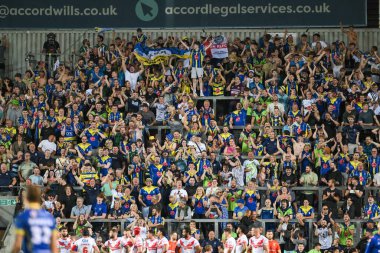 Warrington taraftarları, 18. Betfred Süper Lig karşılaşmasında Warrington Wolves 'a karşı mücadele eden Warrington Wolves takımı Matty Nicholson' ı 19 Temmuz 2024 'te St. Helens, St Helens, İngiltere' de kutladılar.