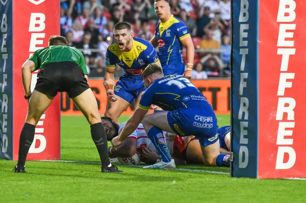 stock image Agnatius Paasi of St. Helens goes over for a tryduring the Betfred Super League Round 18 match St Helens vs Warrington Wolves at Totally Wicked Stadium, St Helens, United Kingdom, 19th July 2024