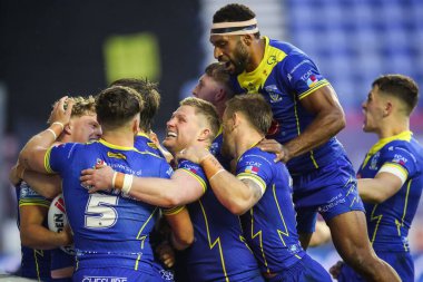 Arron Lindop of Warrington Wolves celebrates his try to make it 4-22 during the Betfred Super League Round 19 match Wigan Warriors vs Warrington Wolves at DW Stadium, Wigan, United Kingdom, 26th July 2024 clipart