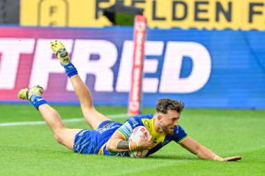 Warrington Wolves 'tan Matty Ashton, 26 Temmuz 2024' te İngiltere 'nin Wigan Stadyumu' nda oynanan 19. Wigan Warriors - Warrington Wolves maçında 4-16 Warrington 'a çıkmaya çalışıyor.