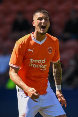 Oliver Casey of Blackpool gives his team instructions during the Pre-season friendly match Blackpool vs Sunderland at Bloomfield Road, Blackpool, United Kingdom, 27th July 2024