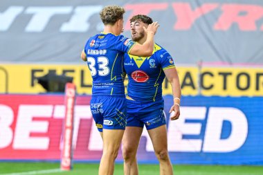 Warrington Wolves 'tan Matty Ashton, 26 Temmuz 2024' te İngiltere 'nin Wigan Stadyumu' nda oynanan 19. Wigan Warriors - Warrington Wolves maçında 4-16 Warrington 'a katılma çabasını kutluyor.