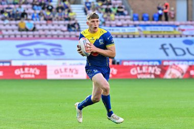 Matty Nicholson of Warrington Wolves carries the ball forward during the Betfred Super League Round 19 match Wigan Warriors vs Warrington Wolves at DW Stadium, Wigan, United Kingdom, 26th July 2024
