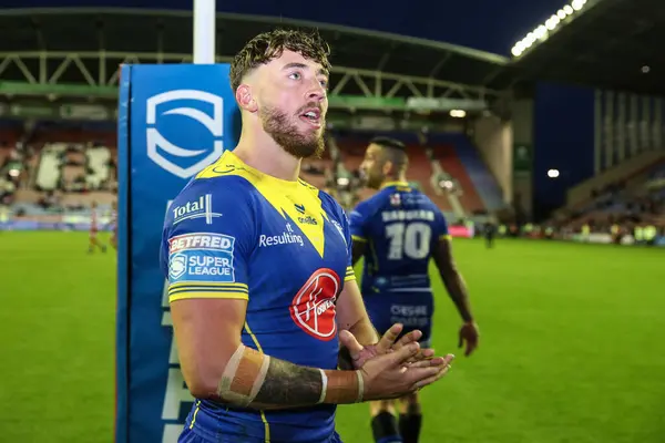 stock image Matty Ashton of Warrington Wolves applauds the travelling fans after the Betfred Super League Round 19 match Wigan Warriors vs Warrington Wolves at DW Stadium, Wigan, United Kingdom, 26th July 2024