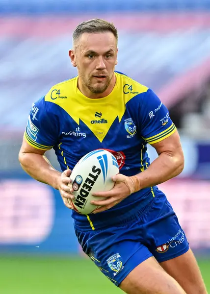 Ben Currie of Warrington Wolves in action during the Betfred Super League Round 19 match Wigan Warriors vs Warrington Wolves at DW Stadium, Wigan, United Kingdom, 26th July 2024