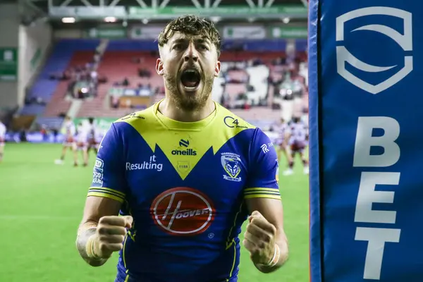 stock image Matty Ashton of Warrington Wolves celebrates his teams win after the Betfred Super League Round 19 match Wigan Warriors vs Warrington Wolves at DW Stadium, Wigan, United Kingdom, 26th July 2024