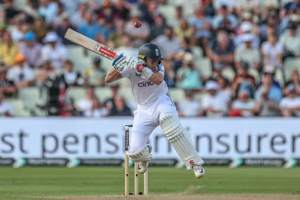 stock image Ollie Pope of England jumps out the way of a bouncer from Jayden Seales of West Indies during the 3rd Rothesay Test Match Day One match England vs West Indies at Edgbaston, Birmingham, United Kingdom, 26th July 2024