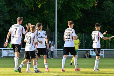 Legia Warsaw celebrates Bartosz Kapustka of Legia Warszawa goal to make it 0-1 Legia Warsaw during the UEFA Europa Conference League Second Qualifying Round 2nd leg match Caernarfon Town vs Legia Warsaw at Nantporth, Bangor, United Kingdom clipart