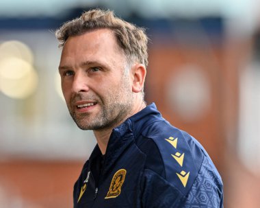 John Eustace manager of Blackburn Rovers walks towards the bench ahead of kick off during the Pre-season friendly match Stockport County vs Blackburn Rovers at Edgeley Park Stadium, Stockport, United Kingdom, 2nd August 2024 clipart