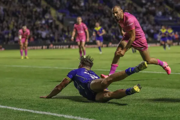 stock image Matty Ashton of Warrington Wolves goes over for a try during the Betfred Super League Round 20 match Warrington Wolves vs Hull KR at Halliwell Jones Stadium, Warrington, United Kingdom, 2nd August 2024