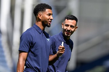 Neal Maupay of Everton shares a joke with Mason Holgate of Everton as they inspect the pitch ahead of the Pre-season friendly match Preston North End vs Everton at Deepdale, Preston, United Kingdom, 3rd August 2024