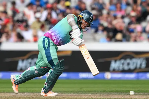 stock image Sam Curran of Oval Invincibles clips the ball for a single during the The Hundred match Manchester Originals vs Oval Invincibles at Old Trafford, Manchester, United Kingdom, 6th August 2024