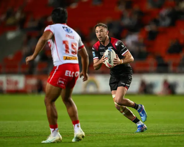 stock image Ryan Brierley of Salford Red Devils in action during the Betfred Super League Round 21 match St Helens vs Salford Red Devils at Totally Wicked Stadium, St Helens, United Kingdom, 8th August 2024