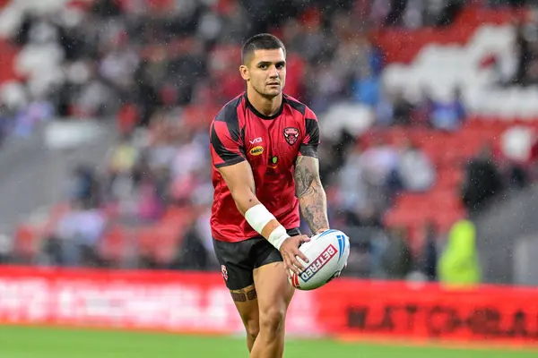 stock image Jayden Nikorima of Salford Red Devils warms up ahead of the Betfred Super League Round 21 match St Helens vs Salford Red Devils at Totally Wicked Stadium, St Helens, United Kingdom, 8th August 2024